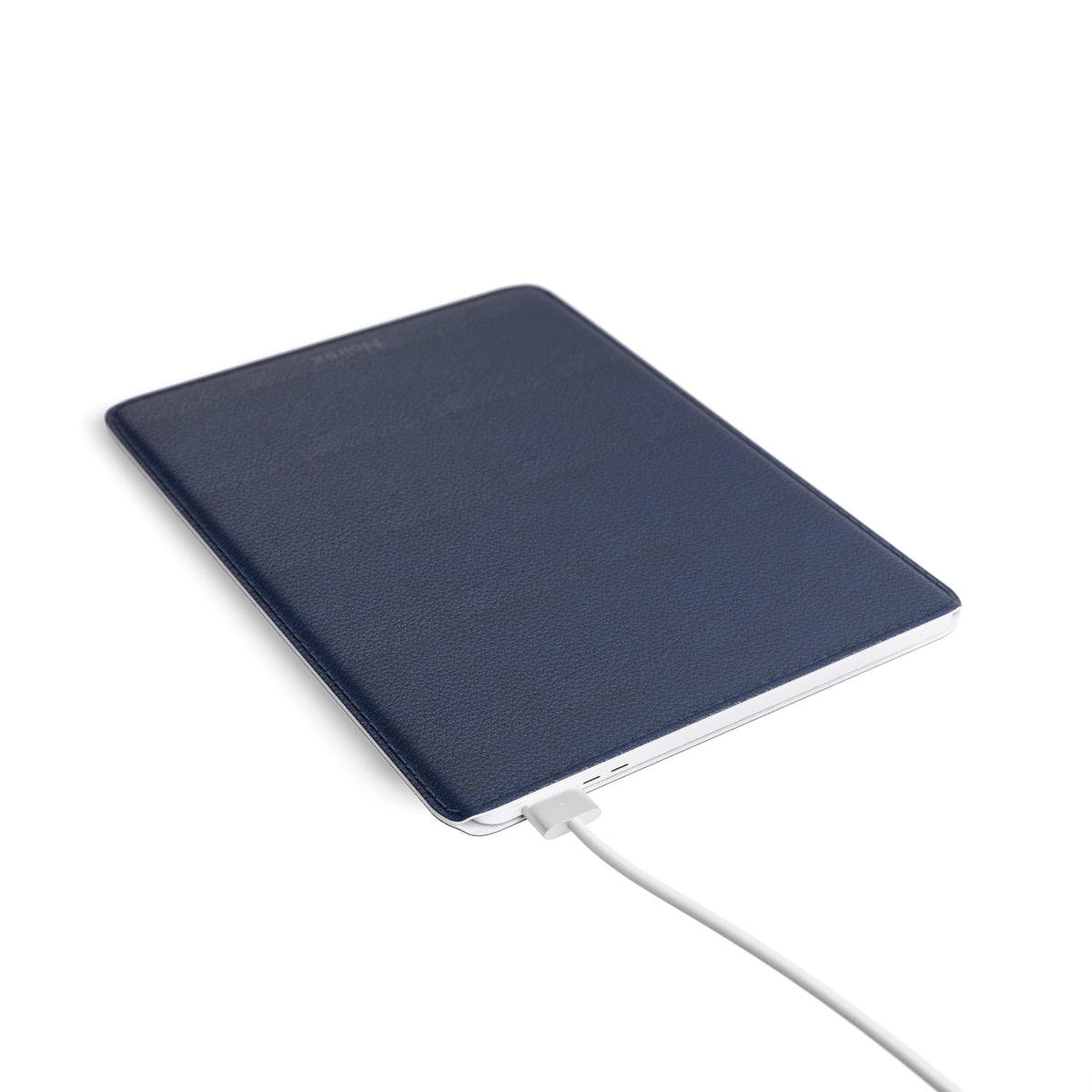 navy blue leather MacBook sleeve angled